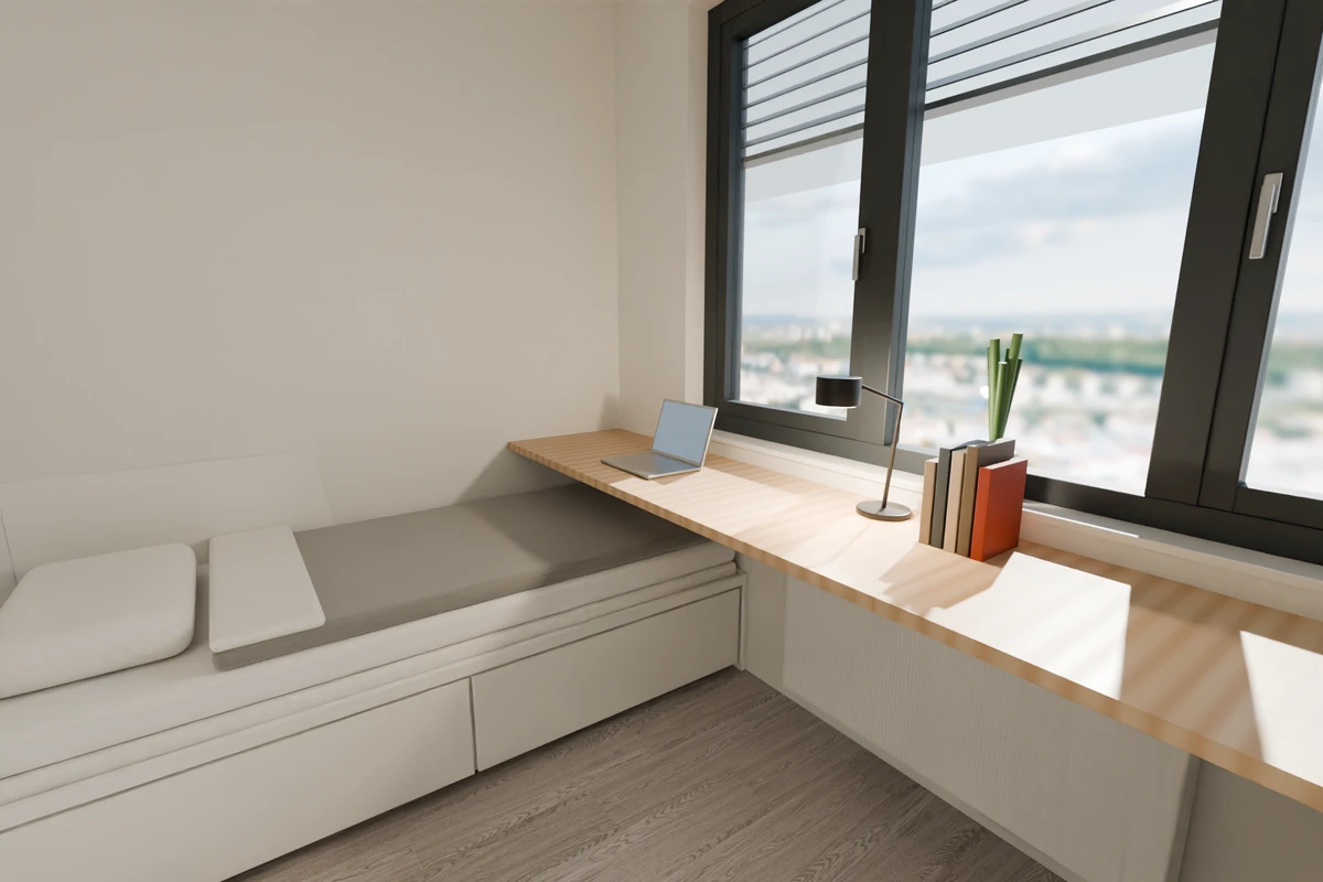 Twin studio Type 01 – 3.3 m oak desk running wall to wall above the radiator and over the low foot end of the bed
